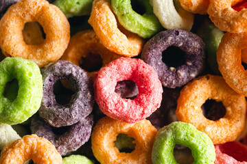 Colored breakfast cereals, food background, children's healthy breakfast, close up.