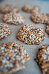 Vegan cookies made of banana and different seeds, photographed with natural light