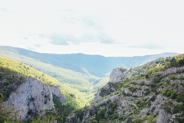 Fototapeta na wymiar beautiful nature green forest mountains blue sky hiking journey