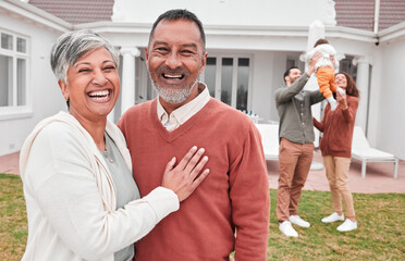 Happy, outdoor and portrait of senior couple standing in the yard of their modern family home....