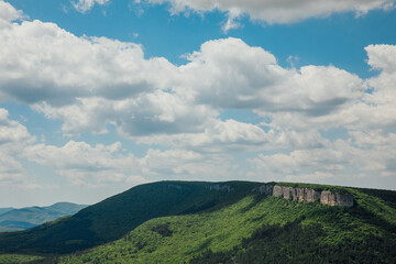 Naklejka premium blue sky beautiful nature green forest mountains hiking journey