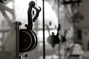 Antique metal electric switch at an abandoned power plant