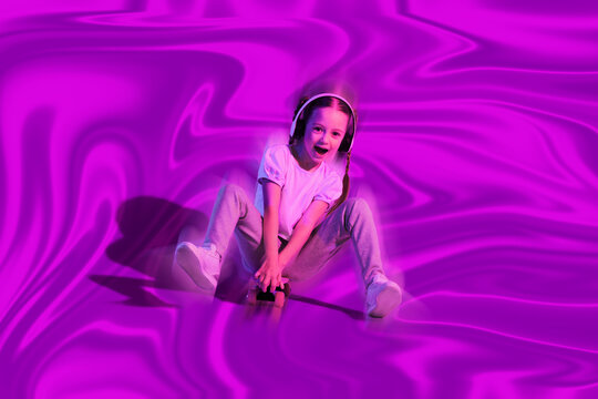 Happy preteen girl having fun on iridescent holographic foil background