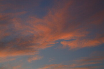 Blurry background of red   sunset sky. Dramatic sky with colorful cloud background. Red burning sunset sky.  Copy space.