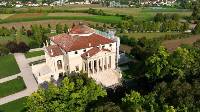 VICENZA - APRIL, 2023: Aerial drone view of palladian Villa Capra. Beautiful ancient architecture conceived by Andrea Palladio. Word famous Unesco architectural monument.