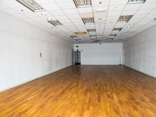 London, UK, April 8th 2023:An empty retail store shop, cleared of all consumer goods following the closing down of business. Concept for economy downturn, recession, out of business and finance.