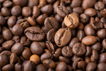 Close up of roasted coffee beans. Aromatic dark coffee beans