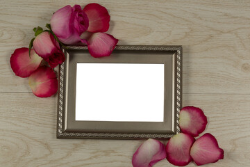 Obraz premium Photo frame and rose flower
