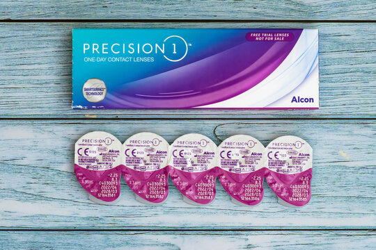 Silicon hydrogel one-day contact lenses in a saline package by Alcon, branded as Precision 1, with smart surface technology.