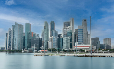 Fototapeta na wymiar Singapore downtown Financial district skyline with moving clouds