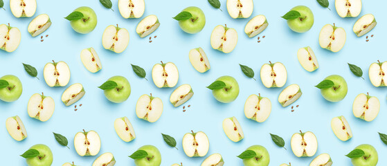 Many ripe apples on light blue background. Pattern for design