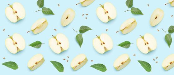 Many cut apples on light blue background. Pattern for design