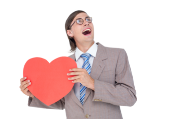 Geeky businessman smiling and holding heart card