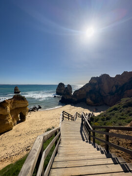 Camilo Beach (Praia do Camilo) at Algarve, Portugal with turquoise sea in background. Wooden footbridge to beach Praia do Camilo, Portugal.