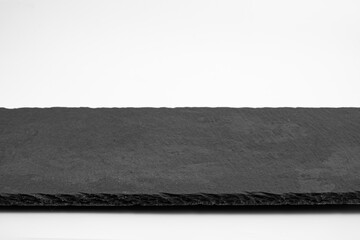 Slate plate isolated on white background. Empty stone tray for food. 