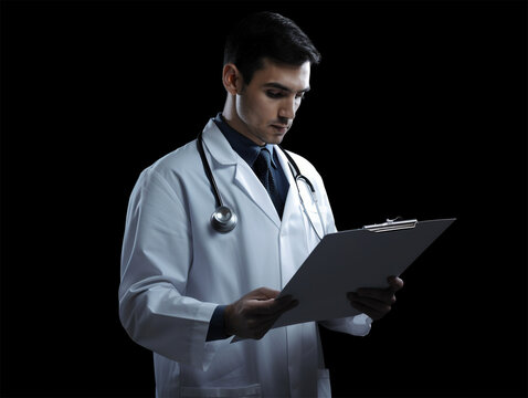 a young male doctor fills out and studies the documents in the medical clinic. the concept of medicine and health. Generative AI