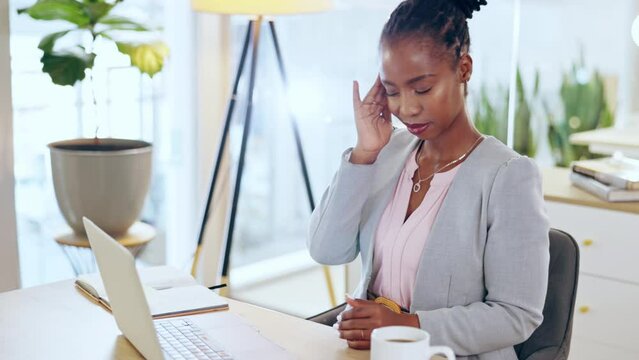 Laptop, business and black woman with headache, pain or migraine in workplace. Mental health, stress and African person with depression, tired or exhausted, sick and burnout, brain fog and fatigue.