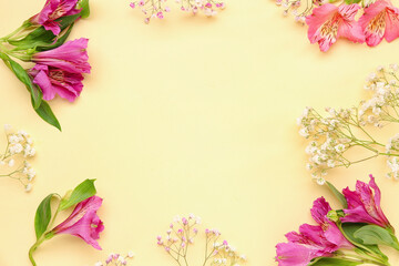 Frame made of alstroemeria and gypsophila flowers on yellow background
