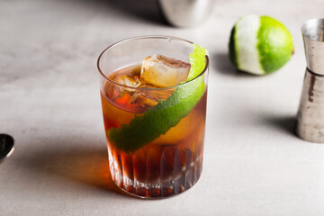 Rabo de Galo cocktail Brazilian boozy cachaça, sweet vermouth, amaro and lime peel as garnish