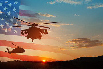 Fototapeta na wymiar Silhouettes of helicopters on background of sunset with a transparent American flag.