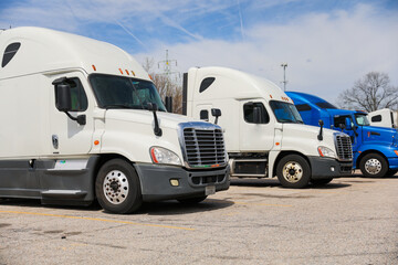 trucks and trucking as symbols of commerce, industry, and mobility. They transport goods across...