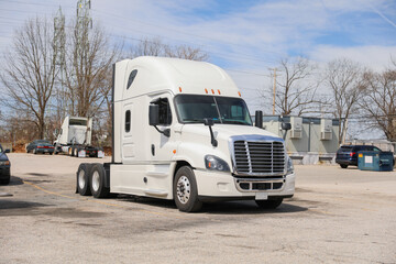 trucks and trucking as symbols of commerce, industry, and mobility. They transport goods across...