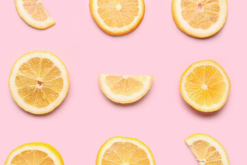 Composition with slices of fresh lemon on pink background