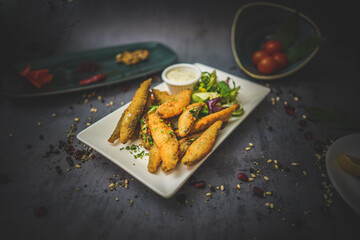 Side Angled View of Fried Anchovy Starter: Crispy Golden Delicacy, Tasty Seafood Dish, Gourmet Food, Appetising Plate, Flavourful Snack, Culinary Treat