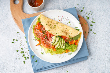 Tasty omelet with vegetables on color grunge background
