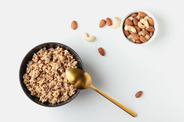 Granola in bowl on light background.
