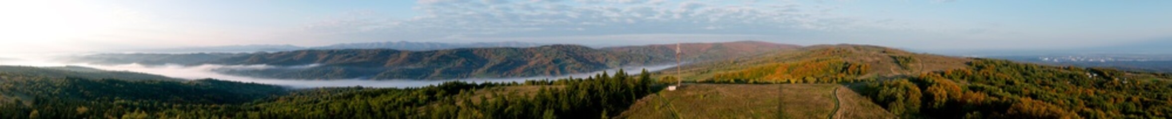 bright sunrise in the mountains with blue sky