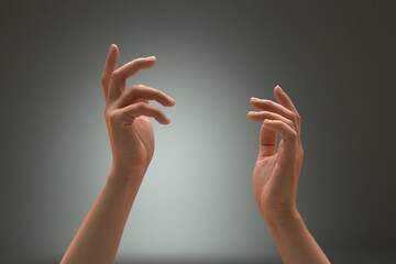 Women's palms upward with relaxed fingers in a dance gesture