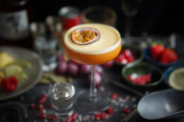 Angled Side View of Exotic Pornstar Martini with Passion Fruit Slice - A Delicious and Tropical Cocktail with a Tangy Twist