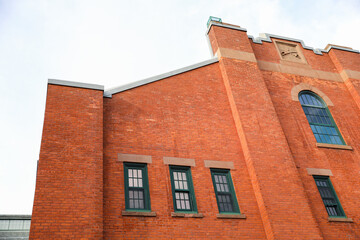 Old brick buildings are a symbol of industrial heritage, innovation, and hard work. They represent the industrial revolution and the rise of manufacturing and industry