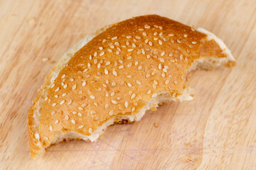 Wheat bun with large pieces of processed cheese inside