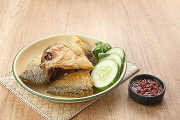 Bandeng Presto or Milkfish with high pressure cooked, served with chilli sauce (sambal), Indonesian food
