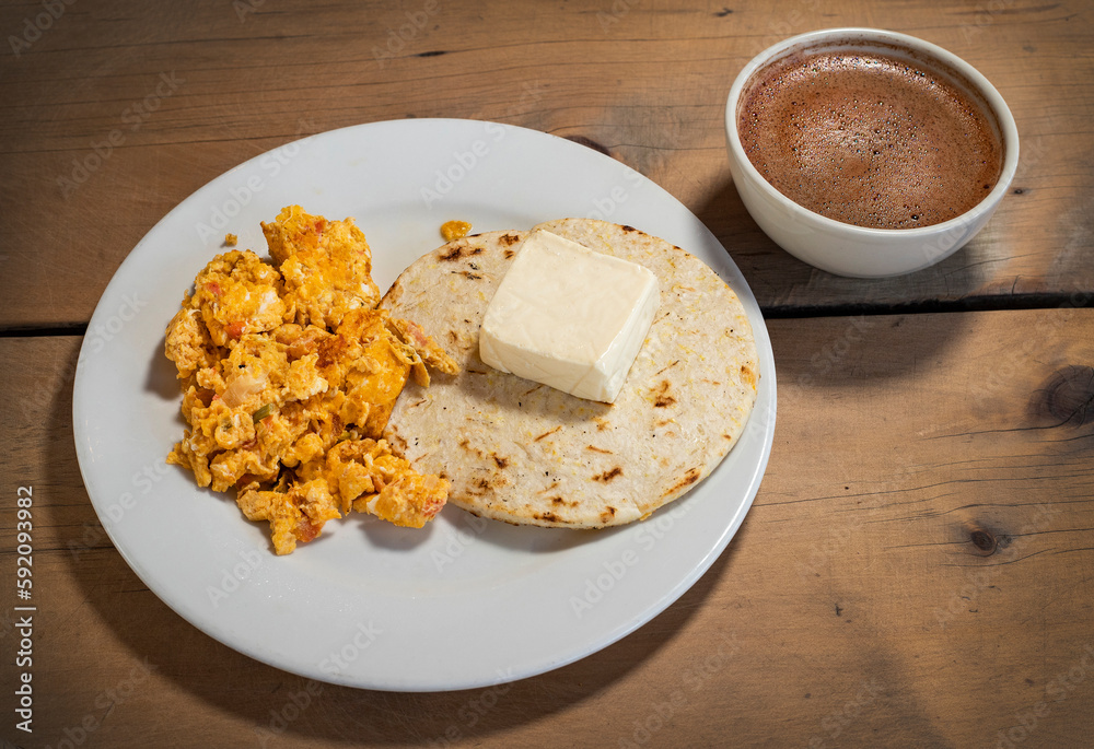 Sticker Arepa with cheese, egg and hot chocolate - Traditional Colombian breakfast