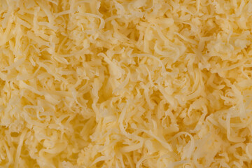 Hard cheese with holes grated into thin small slices