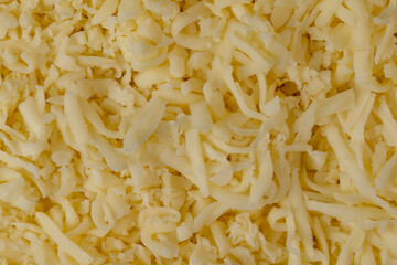 Hard cheese with holes grated into thin small slices