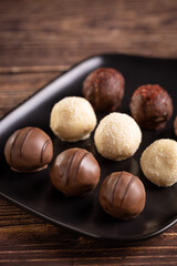Delicious chocolate truffles on the table.