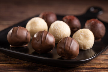 Delicious chocolate truffles on the table.