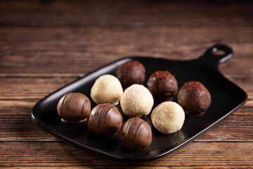 Delicious chocolate truffles on the table.