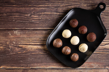 Delicious chocolate truffles on the table.