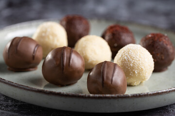 Delicious chocolate truffles on the table.