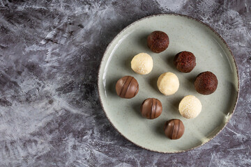 Delicious chocolate truffles on the table.