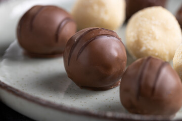 Delicious chocolate truffles on the table.