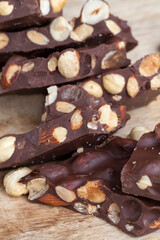 large pieces of milk chocolate with roasted hazelnuts