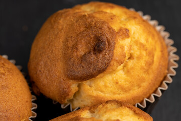 Soft and fresh fragrant wheat cupcake on a black stone