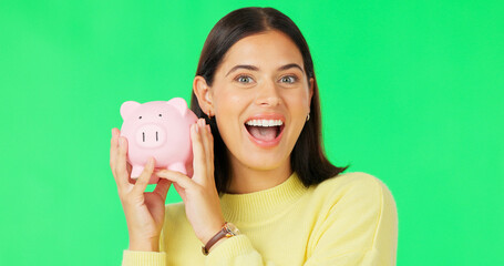 Happy woman, face and money savings on green screen for investment, budget or finance against studio background. Portrait of excited female holding piggybank for coin, profit or investing on mockup