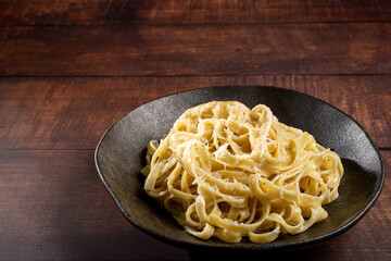 Delicious fettuccine pasta with white cheese sauce. Fettuccine pasta with Alfredo sauce.
